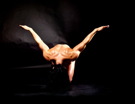 Muscular bodybuilder woman showing her muscles.の写真素材