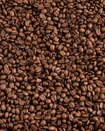 Brown coffee beans, close-up of coffee beans for background and textureの写真素材