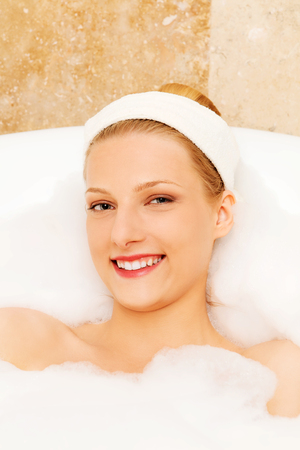 A young woman in the bathの写真素材