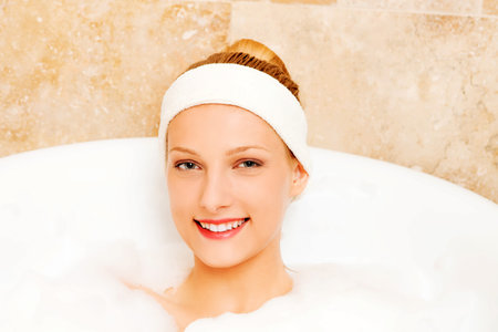 A young woman in the bath