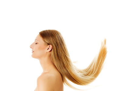 Beautiful long blonde hair, isolated on white.の写真素材