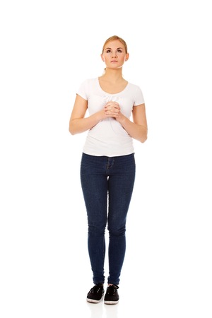 Young woman praying - religion conceptの写真素材