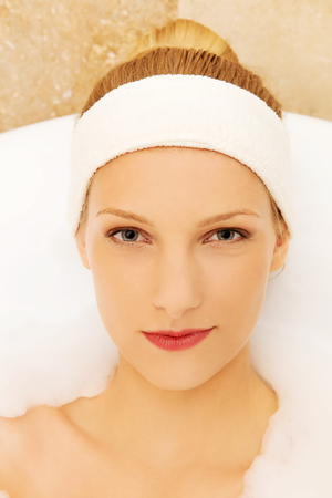 A young woman in the bathの写真素材