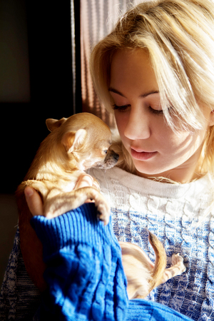 Young woman with pet dogの写真素材