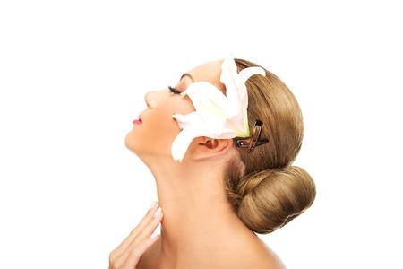 Beautiful spa woman with lily.の写真素材