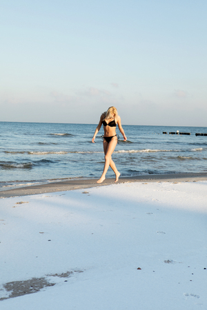 Young woman preapering for ice swimmingの写真素材