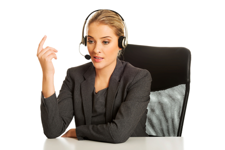 Call center woman sitting at the deskの写真素材