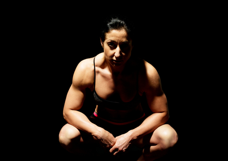 Muscular bodybuilder woman showing her muscles.の写真素材