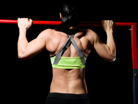 Women excercising on rod