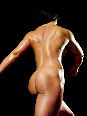 Muscular bodybuilder woman showing her muscles.の写真素材