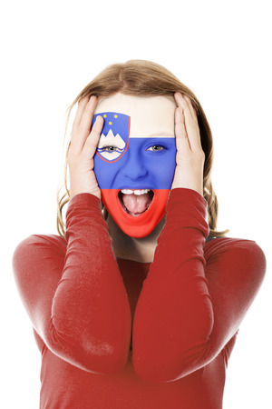 Woman with Slovenia flag on face.の写真素材