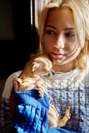 Young woman with pet dogの写真素材