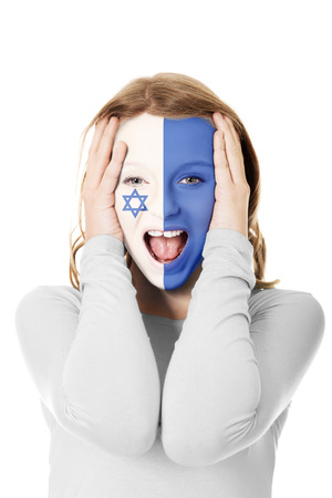 Woman with Israel flag on face.の写真素材
