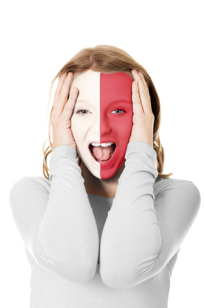 Woman with Malta flag on face.の写真素材