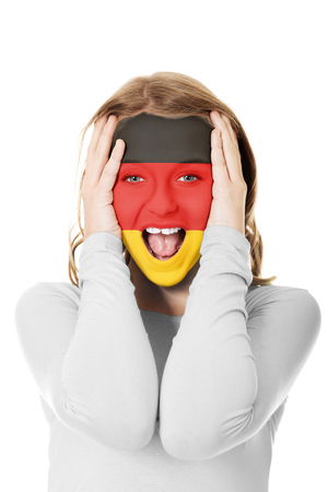 Woman with Germany flag on face.の写真素材