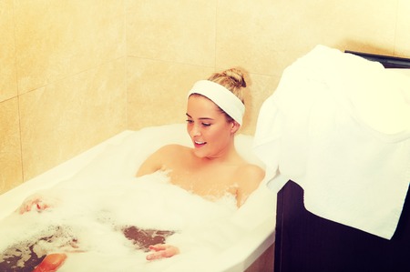 Young woman relaxing in bathの写真素材