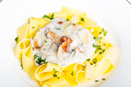 Pasta with cream sauce with chanterelle.の写真素材