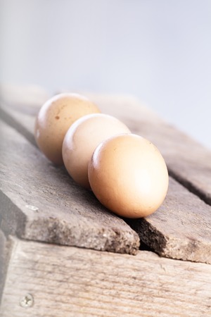 Three raw or boiled chicken eggs.の写真素材