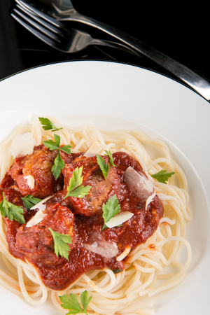 Pasta with meatballs and tomato sauce.の写真素材