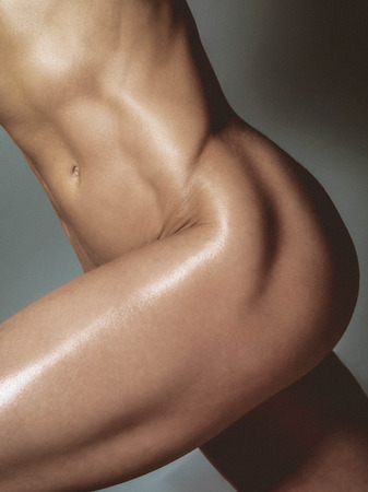 Nude athletic woman body.の写真素材