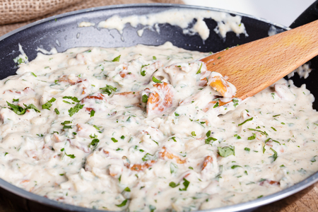 Chanterelle cream sauce on the pan.の写真素材
