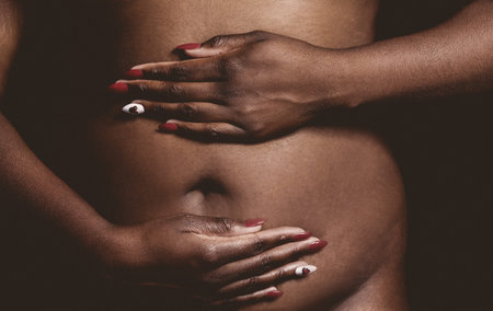 Black woman fat bellyの写真素材