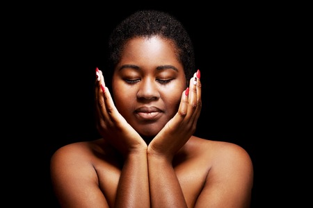 Black woman face with close eyesの写真素材
