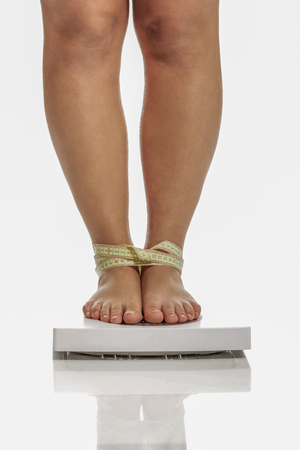 Diet concept, fat woman on weightの写真素材