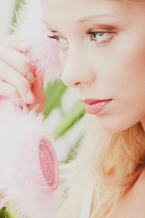 Retro blond woman callingの写真素材
