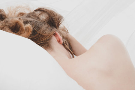 Dreaming blond woman in bed