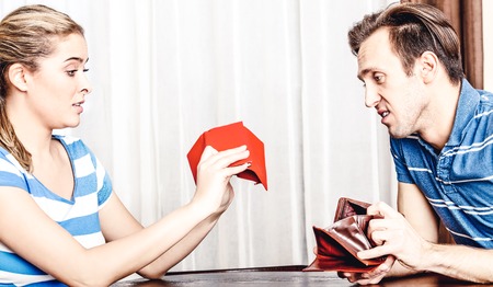 Couple looking for money in walletの写真素材