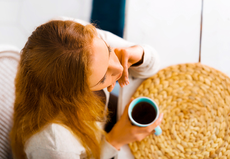 Woman drinking coffee in morningの写真素材