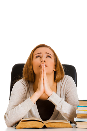 Woman praying for pass examの写真素材
