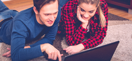 Young couple with laptopの写真素材