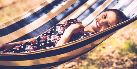 Woman lying in hammockの写真素材