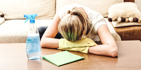 Tired woman feed because of cleaning