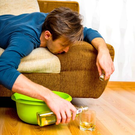 Sad alcoholic still drinkingの写真素材