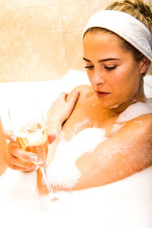 Woman bathing in luxury hotelの写真素材