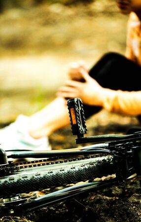 Biker with injured legの写真素材