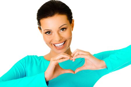 Woman doing heart shapeの写真素材