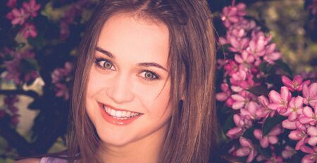 Woman in flowers backgroundの写真素材