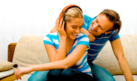 Happy couple in homeの写真素材