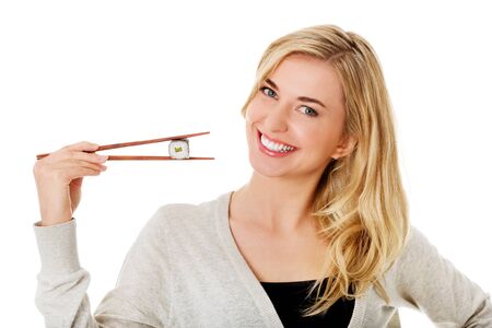 Woman eating sushiの写真素材