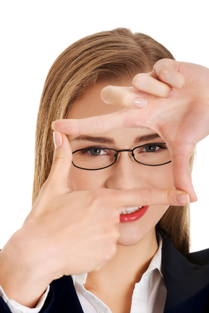 Woman makes frame from handsの写真素材