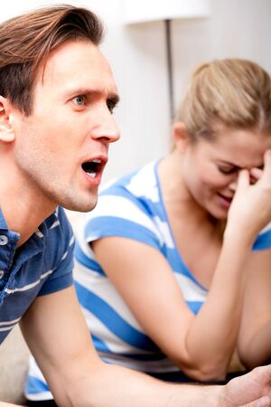 Woman crying because of shouting manの写真素材