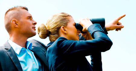 Business peole with binocularsの写真素材