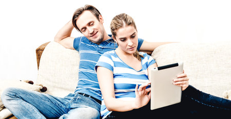 Watching news on tabletの写真素材