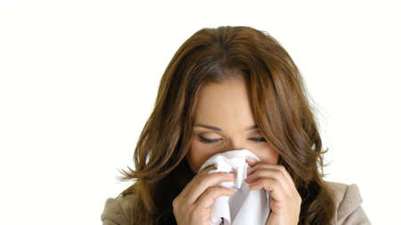 Ill businesswoman using tissue.の写真素材
