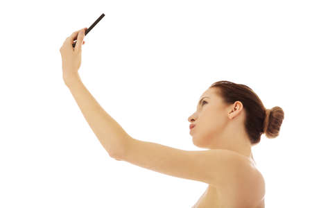 Young woman taking selfieの写真素材