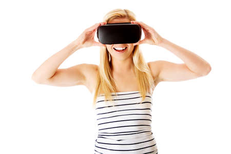 Woman with VR headset glasses device. Virtual reality concept.の写真素材